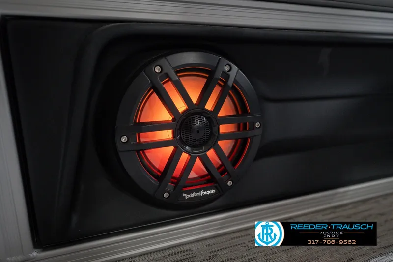Slide: The Image of Illuminated Rockford Fosgate speaker on 2026 Bennington 22 MSB boat, Reeder-Trausch Marine logo visible. - 45