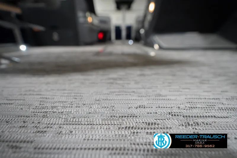 Slide: The Image of Carpeted interior of 2026 Bennington 22 MSB boat, showcasing modern design and comfort. - 48