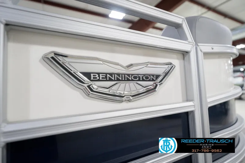 Slide: The Image of 2026 Bennington 22 MSB boat emblem with Reeder-Trausch Marine logo and contact information. - 49