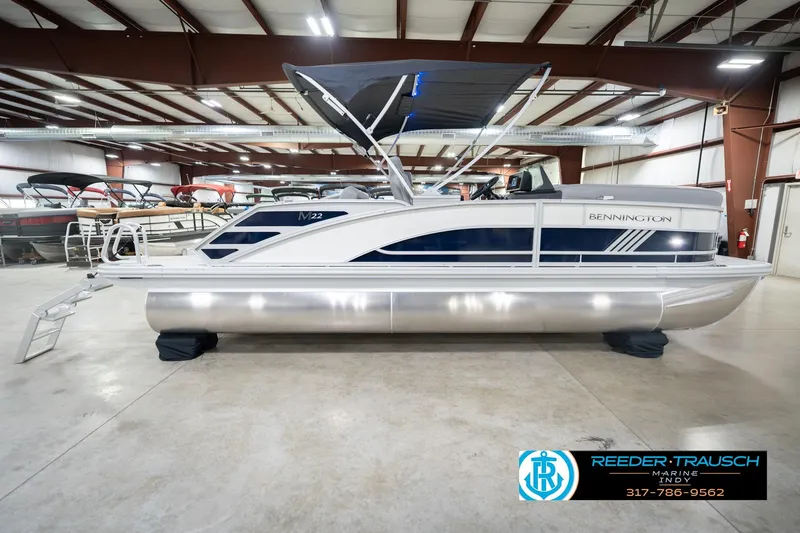 Slide: The Image of 2026 Bennington 22 MSB pontoon boat in showroom, side view. - 5
