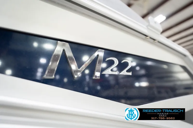 Slide: The Image of 2026 Bennington 22 MSB boat emblem with Reeder-Trausch Marine logo in the foreground. - 51
