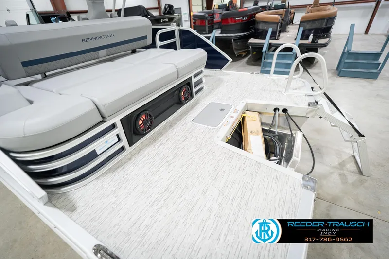 Slide: The Image of 2026 Bennington 22 MSB pontoon boat interior with seating and storage compartment. - 52