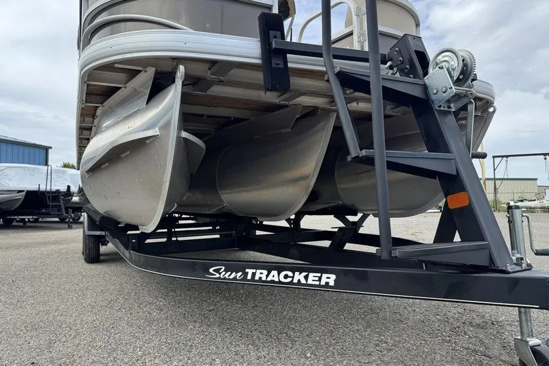 Slide: The Image of 2018 Sun Tracker SportFish 22 XP3 pontoon boat on a trailer, viewed from below. - 15