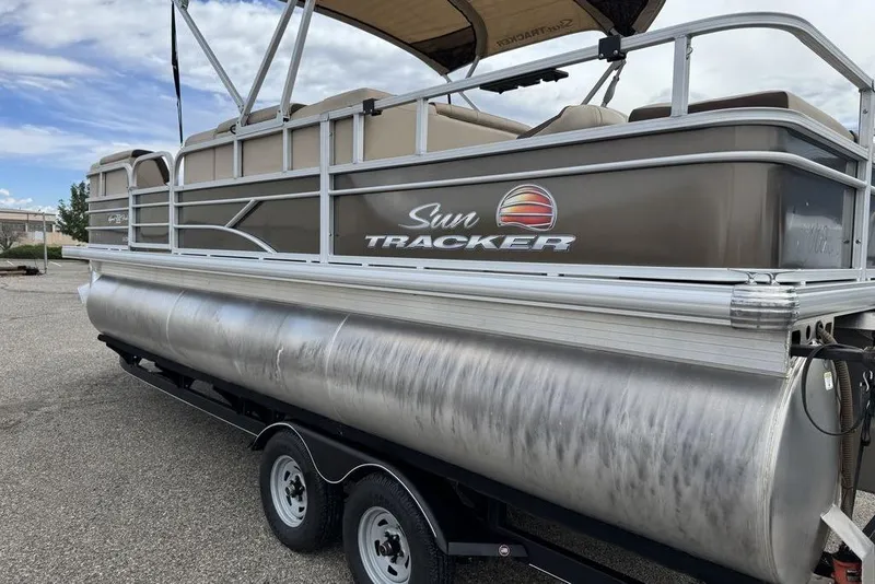 Slide: The Image of 2018 Sun Tracker SportFish 22 XP3 pontoon boat on trailer, side view. - 21