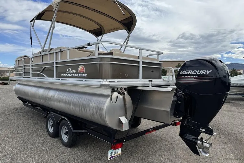 Slide: The Image of 2018 Sun Tracker SportFish 22 XP3 pontoon boat with Mercury outboard motor. - 22