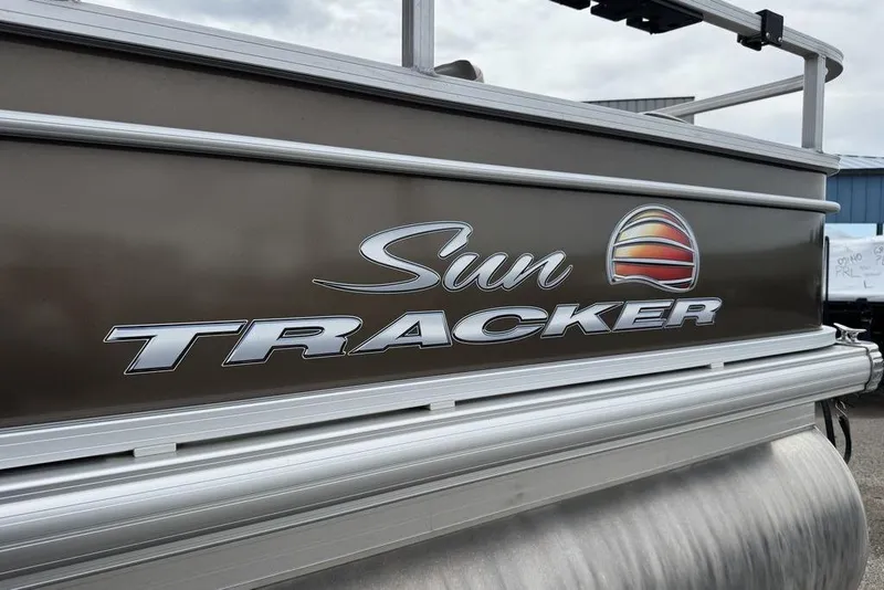 Slide: The Image of 2018 Sun Tracker SportFish 22 XP3 boat logo on metallic exterior. - 26
