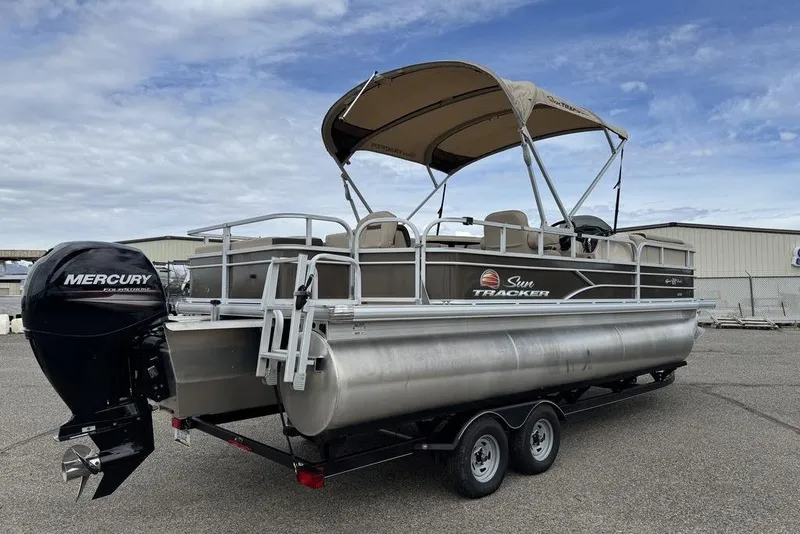 Slide: The Image of 2018 Sun Tracker SportFish 22 XP3 pontoon boat with Mercury outboard motor on trailer. - 3