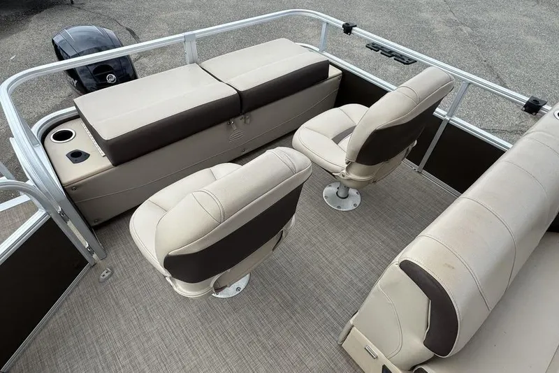 Slide: The Image of 2018 Sun Tracker SportFish 22 XP3 boat interior with beige seating and cup holders. - 35
