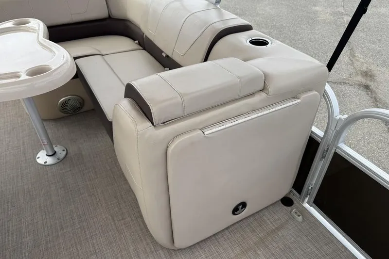 Slide: The Image of 2018 Sun Tracker SportFish 22 XP3 interior with beige seating and table. - 45