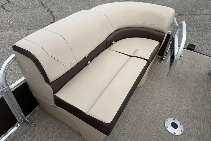 Slide: The Image of 2018 Sun Tracker SportFish 22 XP3 boat interior with beige and brown seating. - 49