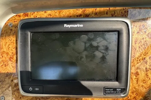 Slide: The Image of 2008 Formula 330 Sun Sport boat in a storage facility, featuring a sleek design and spacious interior. - 10