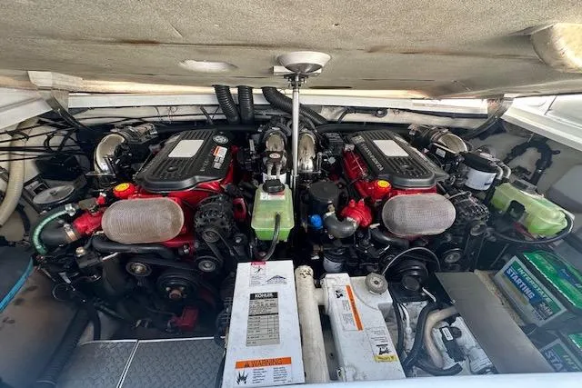 Slide: The Image of 2008 Formula 330 Sun Sport boat in storage, showing dual outboard motors. - 11