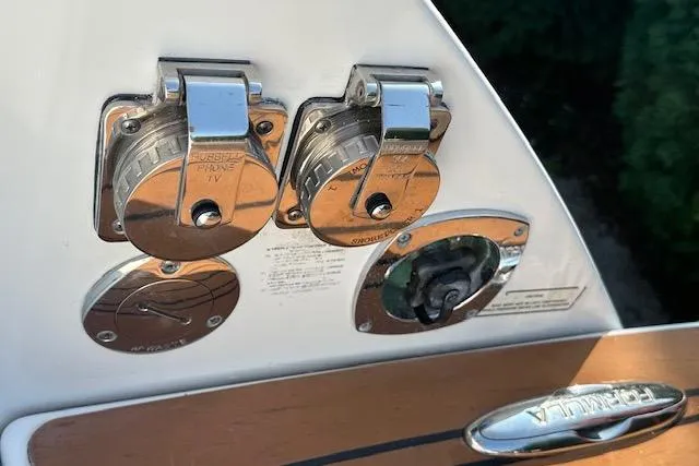 Slide: The Image of 2008 Formula 330 Sun Sport boat interior with white leather seating and cup holders. - 15