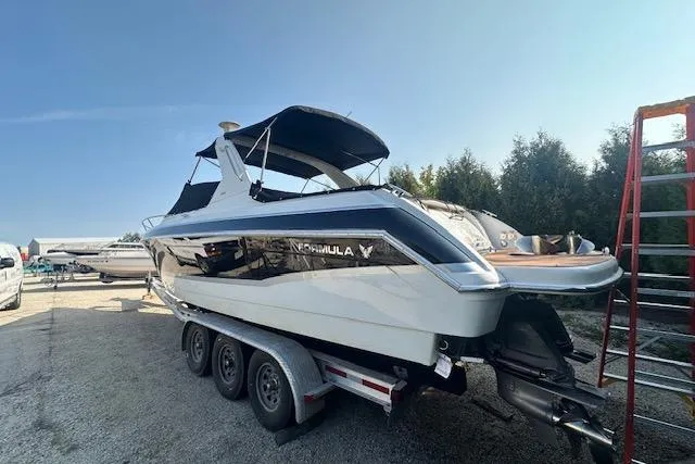 Slide: The Image of 2008 Formula 330 Sun Sport boat interior with white seating and sleek design. - 2