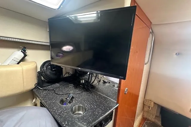 Slide: The Image of Interior of 2008 Formula 330 Sun Sport with TV, seating, and control panel. - 21