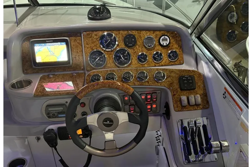 Slide: The Image of Engine compartment of a 2008 Formula 330 Sun Sport boat with visible Kohler generator. - 32