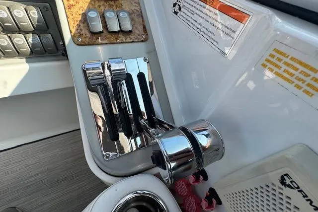 Slide: The Image of 2008 Formula 330 Sun Sport boat on trailer, parked outdoors under clear sky. - 6