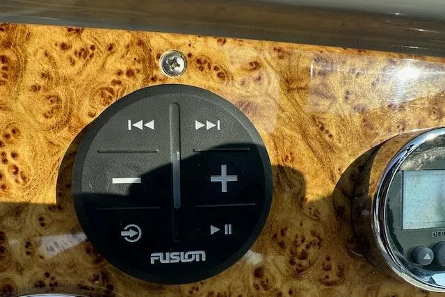 Slide: The Image of 2008 Formula 330 Sun Sport boat on display near a marine service van. - 9