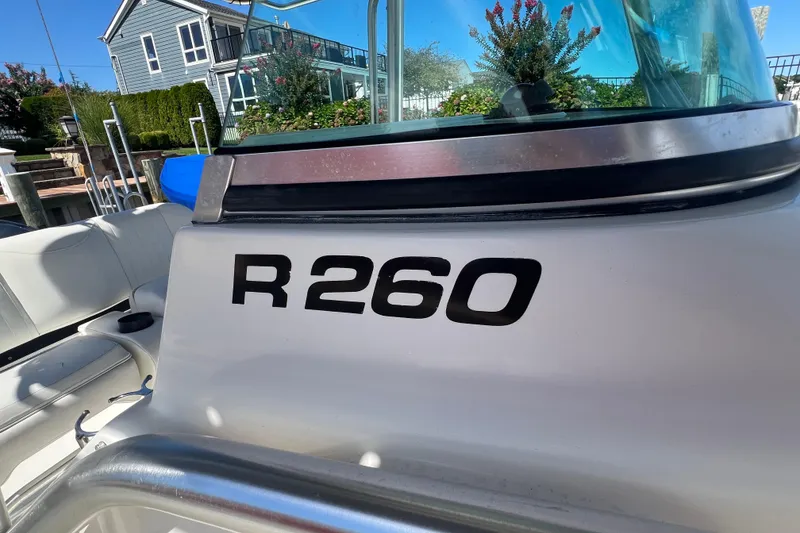 Slide: The Image of 2004 Robalo R260 Center Console boat with sleek design and comfortable seating. - 13