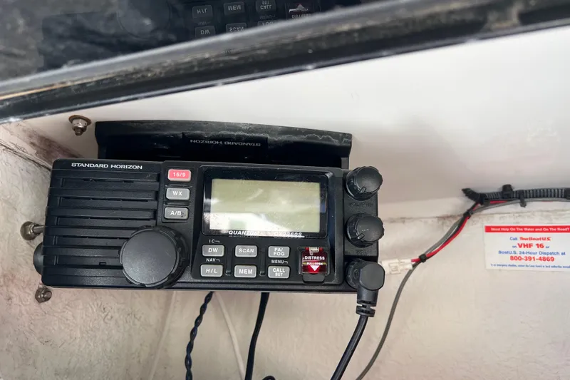 Slide: The Image of Standard Horizon radio on 2004 Robalo R260 Center Console boat dashboard. - 29