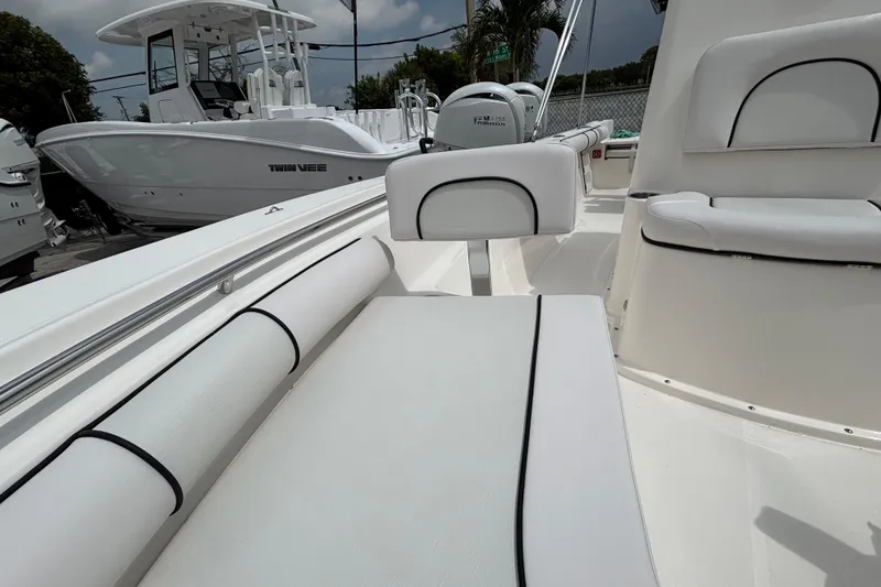 Slide: The Image of 2026 Sea Born LX21 Center Console boat interior with white seating and sleek design. - 10
