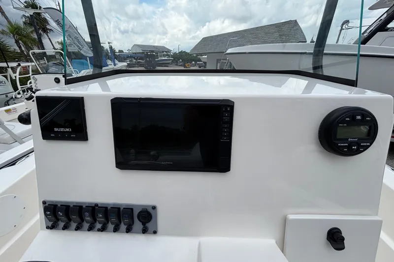 Slide: The Image of 2026 Sea Born LX21 Center Console dashboard with Suzuki and Garmin displays. - 15