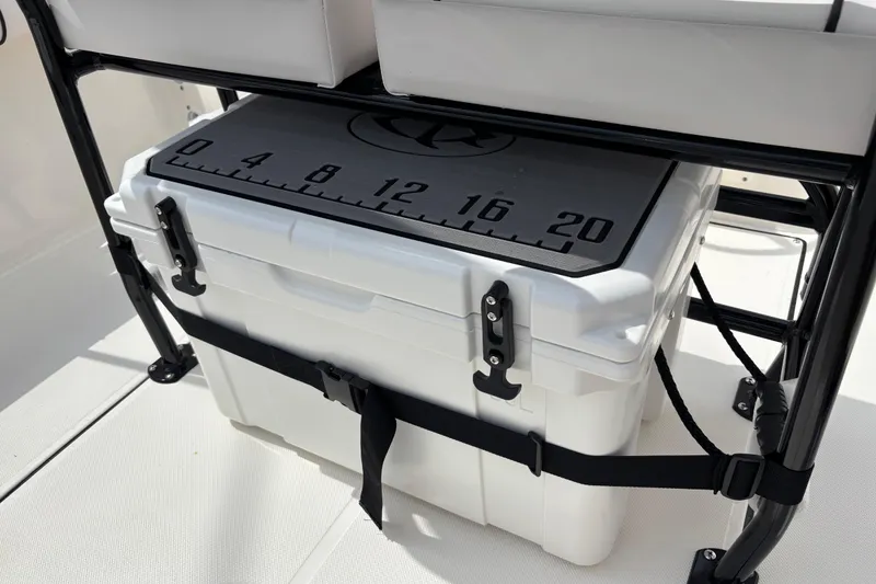 Slide: The Image of White cooler secured on Sea Born LX21 Center Console boat, featuring a measuring scale. - 20