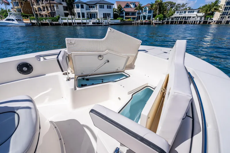 Slide: The Image of 2026 Sea Born LX21 Center Console boat interior with open storage compartments. - 27