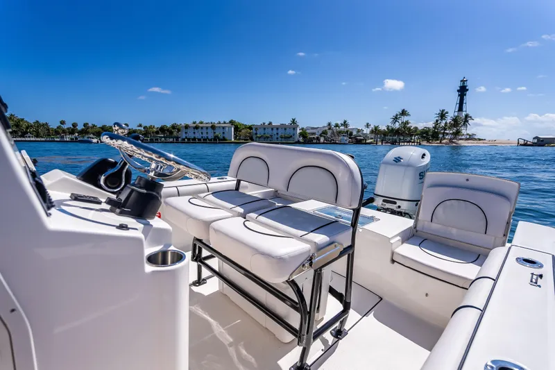 Slide: The Image of 2026 Sea Born LX21 Center Console boat interior with ocean view and lighthouse. - 28