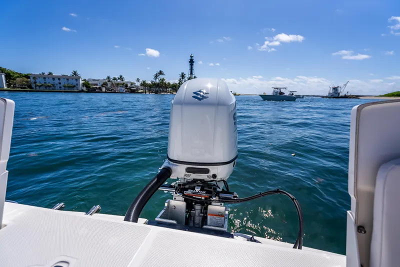 Slide: The Image of 2026 Sea Born LX21 Center Console boat on water, featuring outboard motor. - 30