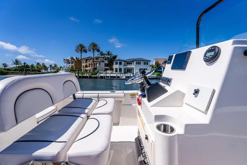 Slide: The Image of 2026 Sea Born LX21 Center Console boat interior with waterfront view. - 32