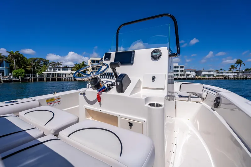 Slide: The Image of 2026 Sea Born LX21 Center Console boat on calm water, clear sky background. - 37