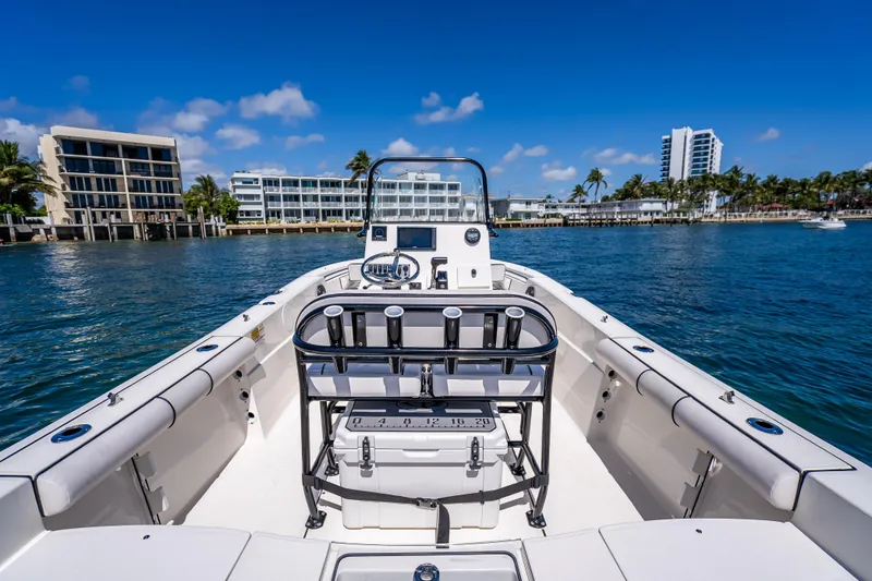 Slide: The Image of 2026 Sea Born LX21 Center Console boat on water with modern buildings in background. - 40