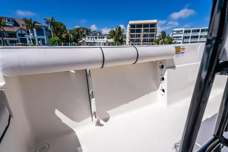 Slide: The Image of 2026 Sea Born LX21 Center Console boat interior with coastal buildings in background. - 42