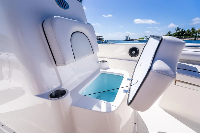 Slide: The Image of 2026 Sea Born LX21 Center Console boat interior with open storage compartment. - 44