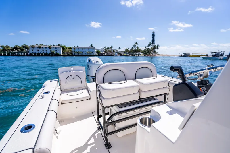 Slide: The Image of 2026 Sea Born LX21 Center Console boat on water with scenic coastal view. - 45
