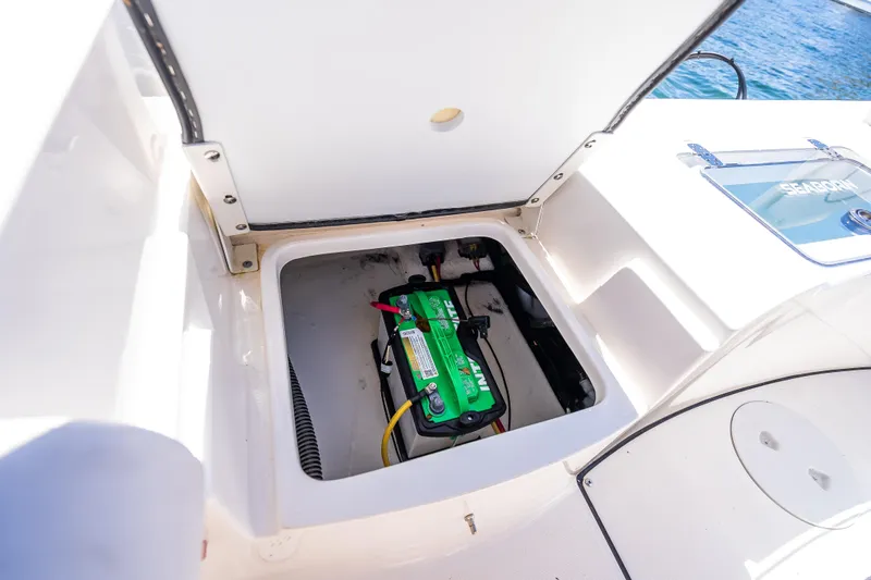 Slide: The Image of Battery compartment of 2026 Sea Born LX21 Center Console boat, open hatch view. - 47