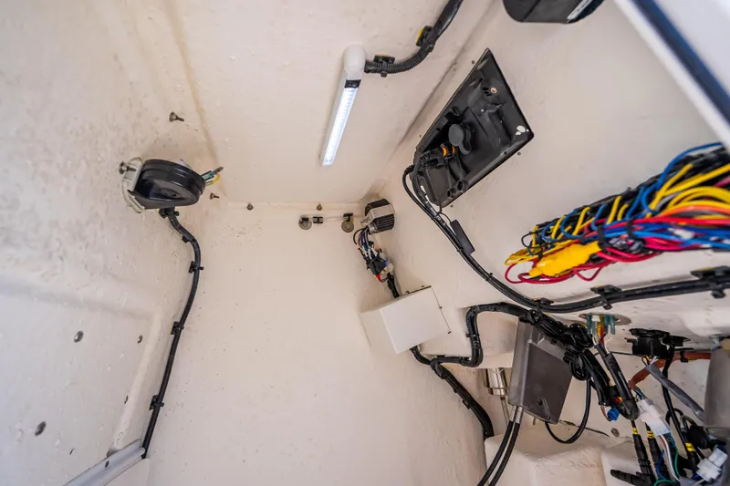 Slide: The Image of 2026 Sea Born LX21 Center Console wiring and electrical components in boat interior. - 49