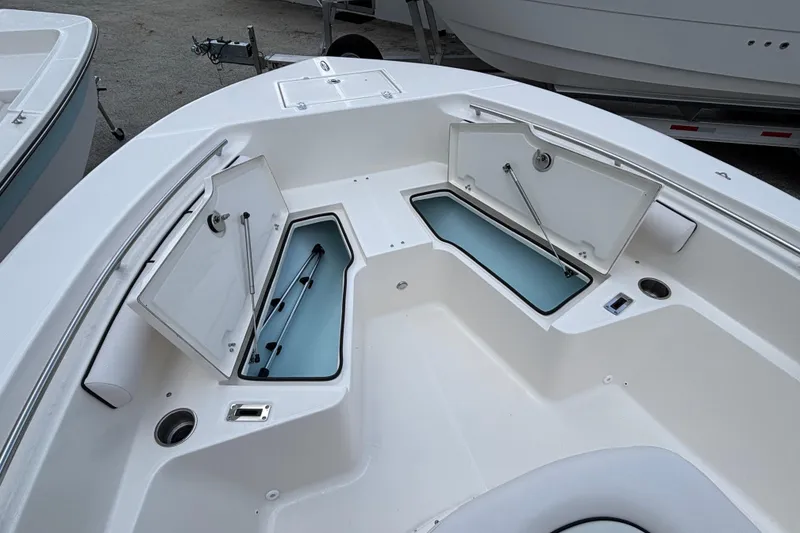 Slide: The Image of 2026 Sea Born LX21 Center Console boat with open storage compartments. - 5