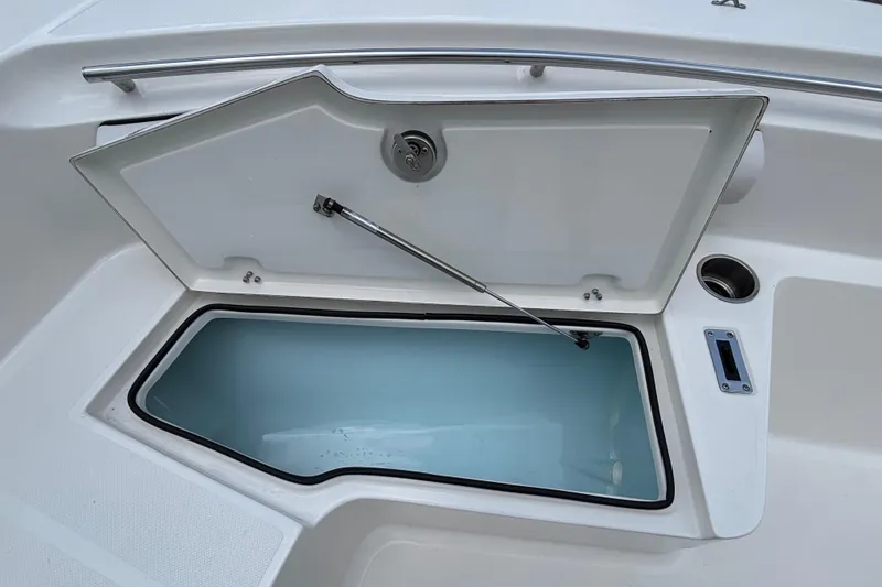 Slide: The Image of Open storage compartment on 2026 Sea Born LX21 Center Console boat. - 6