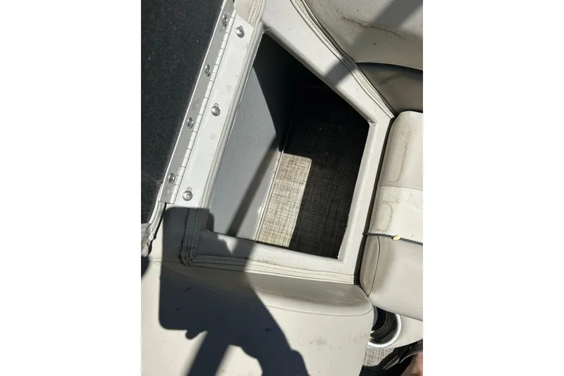 Slide: The Image of Open storage compartment on 2020 Cypress Cay Seabreeze 232 boat seat. - 15