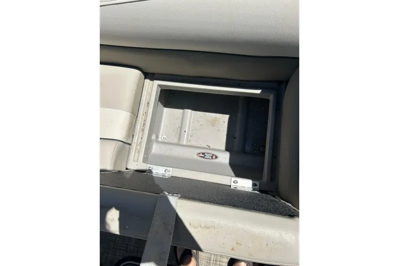 Slide: The Image of 2020 Cypress Cay Seabreeze 232 boat seat storage compartment, open and empty. - 16