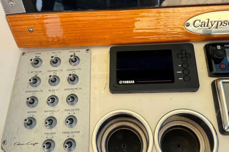 Slide: The Image of Control panel of 2018 Chris-Craft Calypso 30 boat with Yamaha display and switches. - 6
