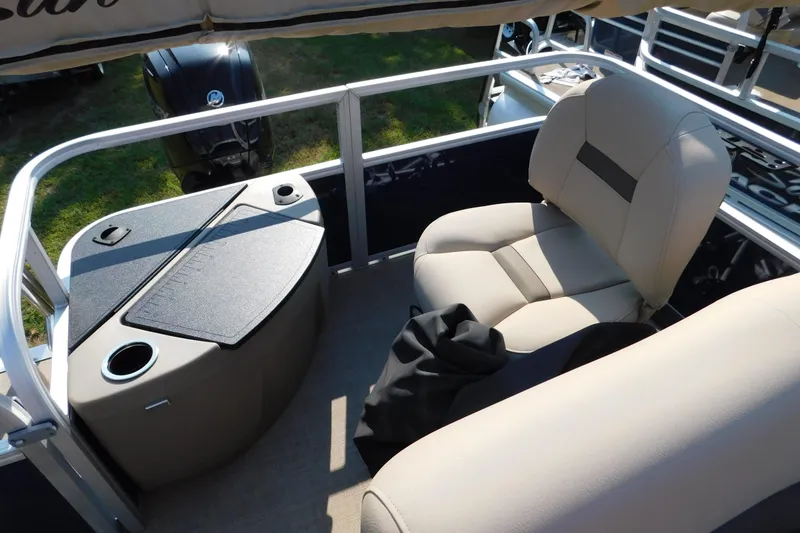 Slide: The Image of 2025 Sun Tracker Bass Buggy boat interior with seating and storage compartments. - 10
