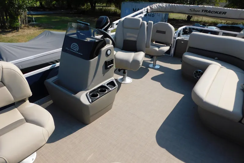 Slide: The Image of 2025 Sun Tracker Bass Buggy interior with seating and console, featuring modern design and comfort. - 7