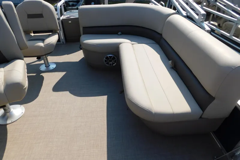 Slide: The Image of 2025 Sun Tracker Bass Buggy interior with beige seating and spacious layout. - 8