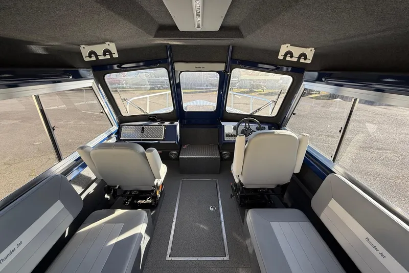 Slide: The Image of Interior of 2025 Thunder Jet 24 Alexis Pro boat, featuring modern seating and controls. - 17