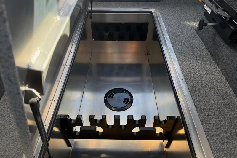 Slide: The Image of Open storage compartment in 2025 Thunder Jet 24 Alexis Pro boat. - 18