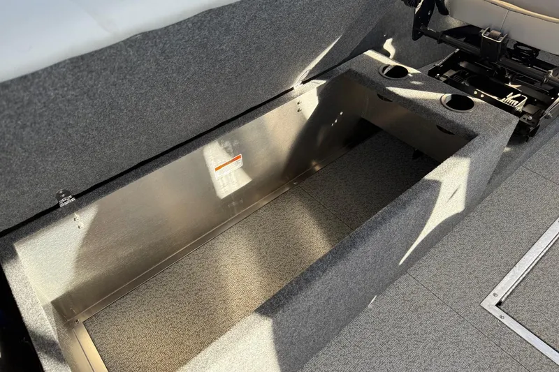 Slide: The Image of 2025 Thunder Jet 24 Alexis Pro boat interior storage compartment with cup holders. - 20