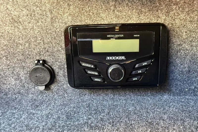 Slide: The Image of Kicker media center in 2025 Thunder Jet 24 Alexis Pro boat interior. - 26